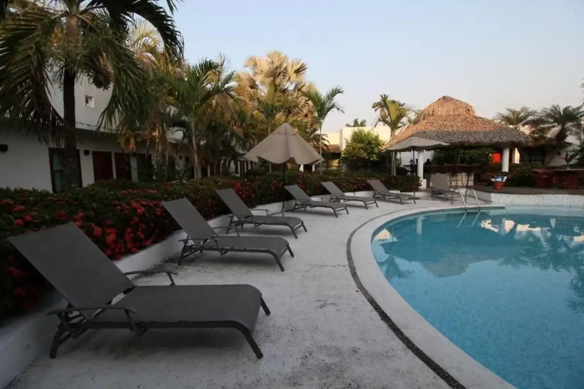 Poolside lounge at Hotel Villa Blanca Suites
